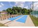 Community shuffleboard courts surrounded by lush landscaping, providing residents with a recreational amenity at 6334 Spring Flower Dr # 24, New Port Richey, FL 34653