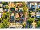 An aerial view showcases this home's location amidst a vibrant neighborhood with lush greenery at 634 6Th N St, St Petersburg, FL 33701
