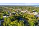 Aerial view of a neighborhood surrounding Round Lake Park with a water fountain at 634 6Th N St, St Petersburg, FL 33701