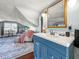 Attic bedroom featuring a vanity and sink, a seating area, and a bed at 634 6Th N St, St Petersburg, FL 33701