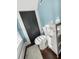 Cozy bathroom features a toilet, linen storage, and a window with light shining in at 634 6Th N St, St Petersburg, FL 33701