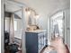 Bathroom featuring a vanity, a large mirror with sconces, and a bathtub with a shower at 634 6Th N St, St Petersburg, FL 33701