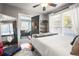 Cozy bedroom with natural light, ceiling fan, and a decorative mirror at 634 6Th N St, St Petersburg, FL 33701