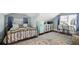 Bedroom featuring an integrated study area and a blue refrigerator, featuring sloped ceilings at 634 6Th N St, St Petersburg, FL 33701