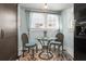Breakfast nook featuring wicker chairs, small glass table, and natural light at 634 6Th N St, St Petersburg, FL 33701
