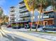 Modern building with multiple balconies and parking in front framed by palm trees on a sunny day at 634 6Th N St, St Petersburg, FL 33701