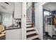 Hallway featuring staircase, view of kitchen, and view of bathroom at 634 6Th N St, St Petersburg, FL 33701
