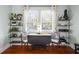 Office space showcasing a workstation between matching shelving units and hardwood flooring at 634 6Th N St, St Petersburg, FL 33701