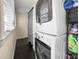 Bright laundry room with stackable washer and dryer, and ample storage space at 634 6Th N St, St Petersburg, FL 33701