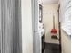 Laundry room featuring a stacked washer and dryer with window and storage hooks at 634 6Th N St, St Petersburg, FL 33701