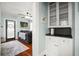 Open living room with built in cabinets, modern decor, and hardwood flooring at 634 6Th N St, St Petersburg, FL 33701