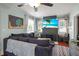 Comfortable living room featuring a large sectional sofa, a television, and a fireplace at 634 6Th N St, St Petersburg, FL 33701