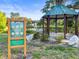 Scenic park view with a gazebo, pond, fountain and signage offering a welcoming outdoor space at 634 6Th N St, St Petersburg, FL 33701