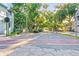 A quiet street lined with mature trees provides shade and enhances the neighborhood's curb appeal at 634 6Th N St, St Petersburg, FL 33701