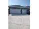 Exterior view of a home featuring an attached two-car garage and concrete driveway at 6615 Vanda Ln, Land O Lakes, FL 34637