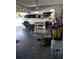 Organized two-car garage featuring epoxied flooring and ample space for storage and parking at 6615 Vanda Ln, Land O Lakes, FL 34637