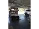 Well-lit garage offering epoxy floors, car parking, and room for storage and a golf cart at 6615 Vanda Ln, Land O Lakes, FL 34637