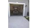 View of a clean and well-maintained garage with an electric golf cart inside at 6615 Vanda Ln, Land O Lakes, FL 34637