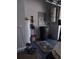 Clean garage featuring a hot water heater and vacuum system with plenty of room for storage at 6615 W Vanda Ln, Land O Lakes, FL 34637