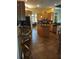Well-lit kitchen with wooden cabinets, granite countertops, stainless steel appliances, and center island at 6615 Vanda Ln, Land O Lakes, FL 34637