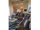 Cozy living room with a plush sectional sofa, zebra rug, and open access to the kitchen at 6615 Vanda Ln, Land O Lakes, FL 34637