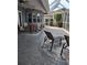 Outdoor patio area with comfortable seating, ceiling fans, and an airy screened enclosure at 6615 Vanda Ln, Land O Lakes, FL 34637