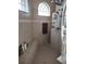 Modern shower with glass block accents, built-in seat, and rainfall shower head in a tiled enclosure at 6615 Vanda Ln, Land O Lakes, FL 34637