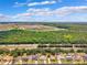 Panoramic aerial shot of the community featuring homes, green spaces, and nearby highway at 6724 Clair Shore Dr, Apollo Beach, FL 33572