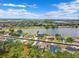 Aerial view showcasing homes along the lake in a beautiful community with many trees at 6724 Clair Shore Dr, Apollo Beach, FL 33572