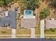 Aerial view of the home with a screened in pool and well-maintained backyard at 6724 Clair Shore Dr, Apollo Beach, FL 33572