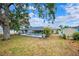 Spacious backyard featuring a screened pool area and additional storage shed at 6724 Clair Shore Dr, Apollo Beach, FL 33572