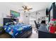 Bedroom is decorated with a ceiling fan, a map accent wall, and gaming decor at 6724 Clair Shore Dr, Apollo Beach, FL 33572