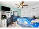 This bedroom has a ceiling fan, a gaming station, neutral walls, and carpet at 6724 Clair Shore Dr, Apollo Beach, FL 33572