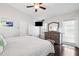 Bright main bedroom with a ceiling fan, neutral walls, and access to the exterior at 6724 Clair Shore Dr, Apollo Beach, FL 33572