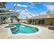 Inviting screened pool with spa, complemented by an outdoor seating area for relaxing or entertaining at 6724 Clair Shore Dr, Apollo Beach, FL 33572