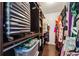 Walk-in closet has ample storage space and wood look flooring at 6724 Clair Shore Dr, Apollo Beach, FL 33572