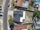 Overhead view of a house with a fenced backyard, showcasing the roof and surrounding landscape at 7131 Vista Way, Port Richey, FL 34668