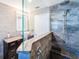 Modern bathroom with a walk-in shower, rain shower head, granite counters, and vessel sink at 7131 Vista Way, Port Richey, FL 34668
