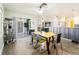 Open concept dining area next to the kitchen and includes the backyard visible from the sliding glass door at 7131 Vista Way, Port Richey, FL 34668