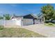 Beautifully renovated home with a modern garage and a well-manicured front yard at 7131 Vista Way, Port Richey, FL 34668