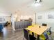 Bright kitchen with stainless steel appliances, dark cabinetry, and an attached dining area at 7131 Vista Way, Port Richey, FL 34668