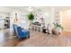 Cozy living room features lots of natural light, modern decor, and gray wood floors at 7131 Vista Way, Port Richey, FL 34668