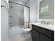 Bathroom featuring bath tub with shower, shower head, vanity, and mirror at 718 W Kentucky Ave, Tampa, FL 33603