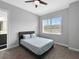 Guest bedroom with a ceiling fan and natural light and carpet with a queen size bed at 718 W Kentucky Ave, Tampa, FL 33603