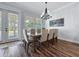 Dining room featuring a dining table set with six chairs and access to the yard via a glass paneled door at 718 W Kentucky Ave, Tampa, FL 33603