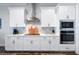 Bright, modern kitchen with sleek white cabinetry, stainless steel appliances, and elegant countertops at 718 W Kentucky Ave, Tampa, FL 33603