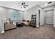 Cozy living room with carpet, comfortable sofas, a ceiling fan, and neutral decor with view to hallway at 718 W Kentucky Ave, Tampa, FL 33603