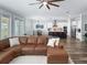 Open concept living space with a modern kitchen and island, a dining area and a large comfortable leather sofa at 718 W Kentucky Ave, Tampa, FL 33603