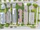 Bird's-eye view of homes in the neighborhood displaying well-kept lawns, driveways, and proximity to community streets at 7238 Milestone Dr, Apollo Beach, FL 33572