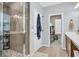 Bathroom showcasing an oversized shower, a door to the closet, and modern fixtures at 7238 Milestone Dr, Apollo Beach, FL 33572